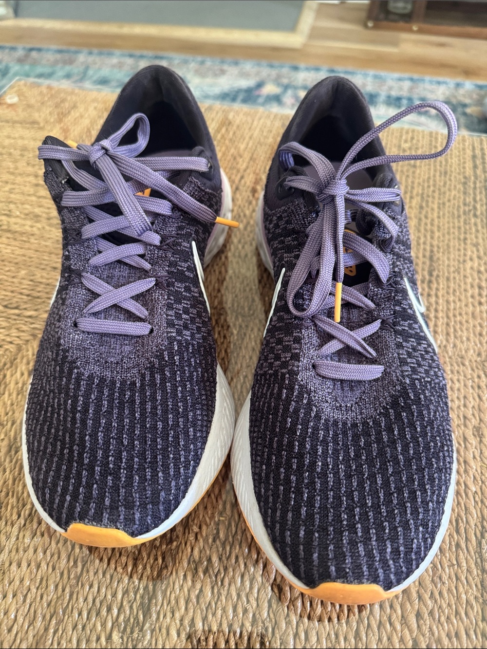 Nike Women's Black and Purple Knit Running Shoes with Orange Accents